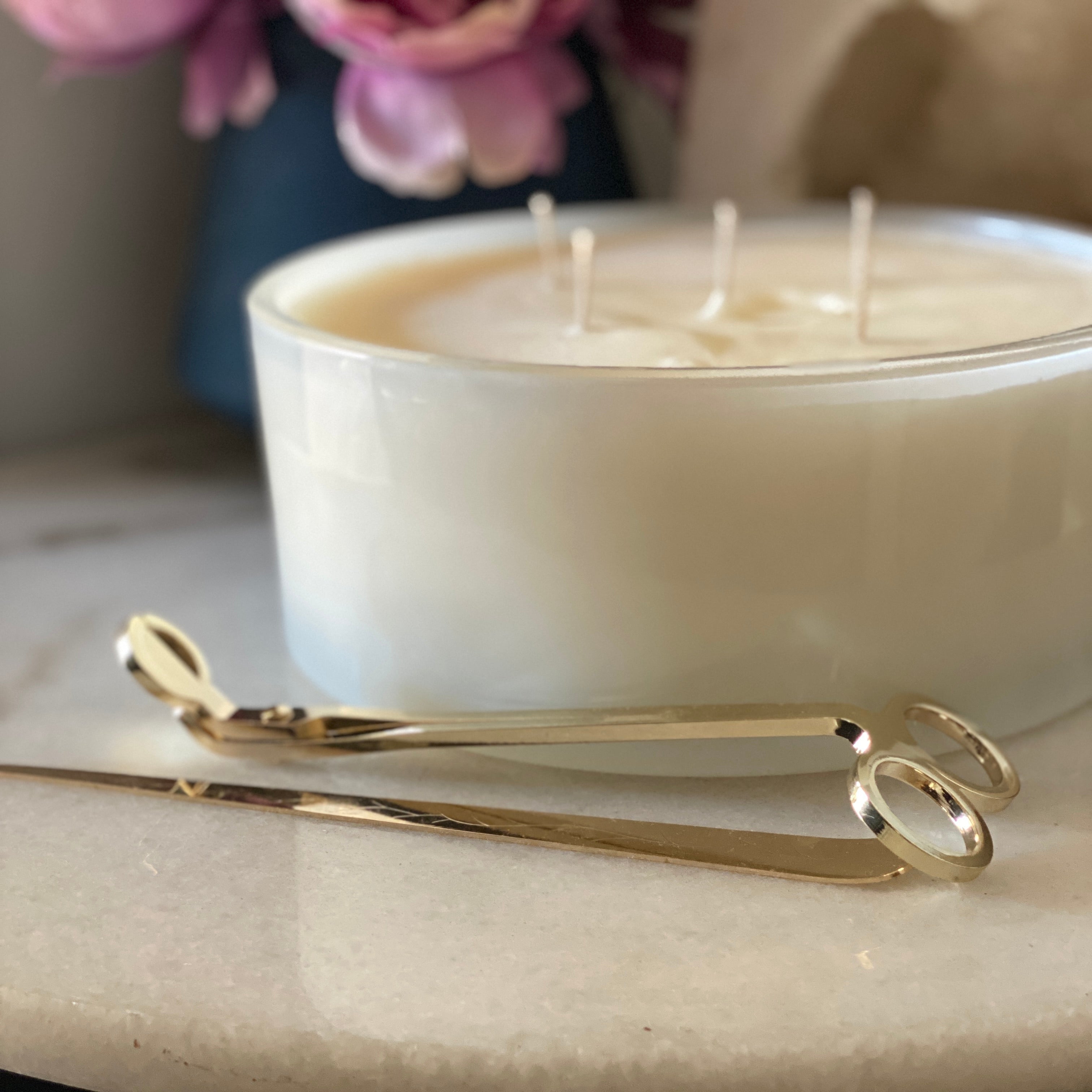 White candle with gold wick trimmer
 Glassware Imports. Candle Making supplies