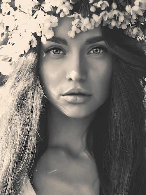 romantic lady in a wreath of apple trees