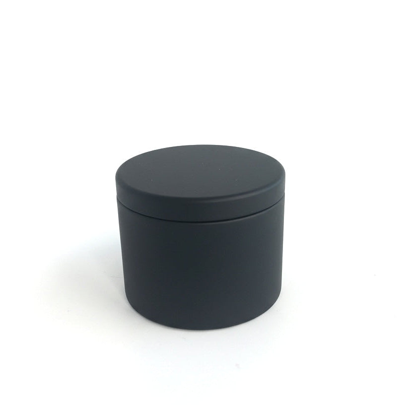 Black Candle Tin container with a lid on a white background