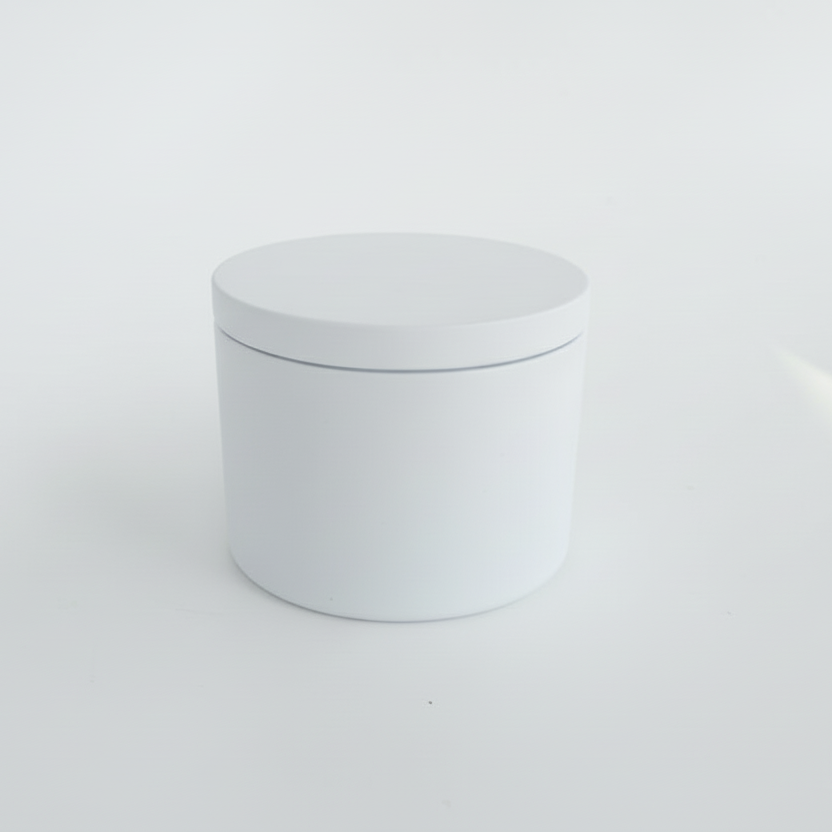 White traveil tin cylindrical container with lid on a light gray background