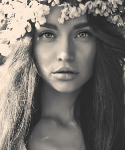 romantic lady in a wreath of apple trees